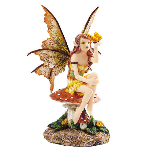 Fairy. Yellow. Sitting w/butterfly